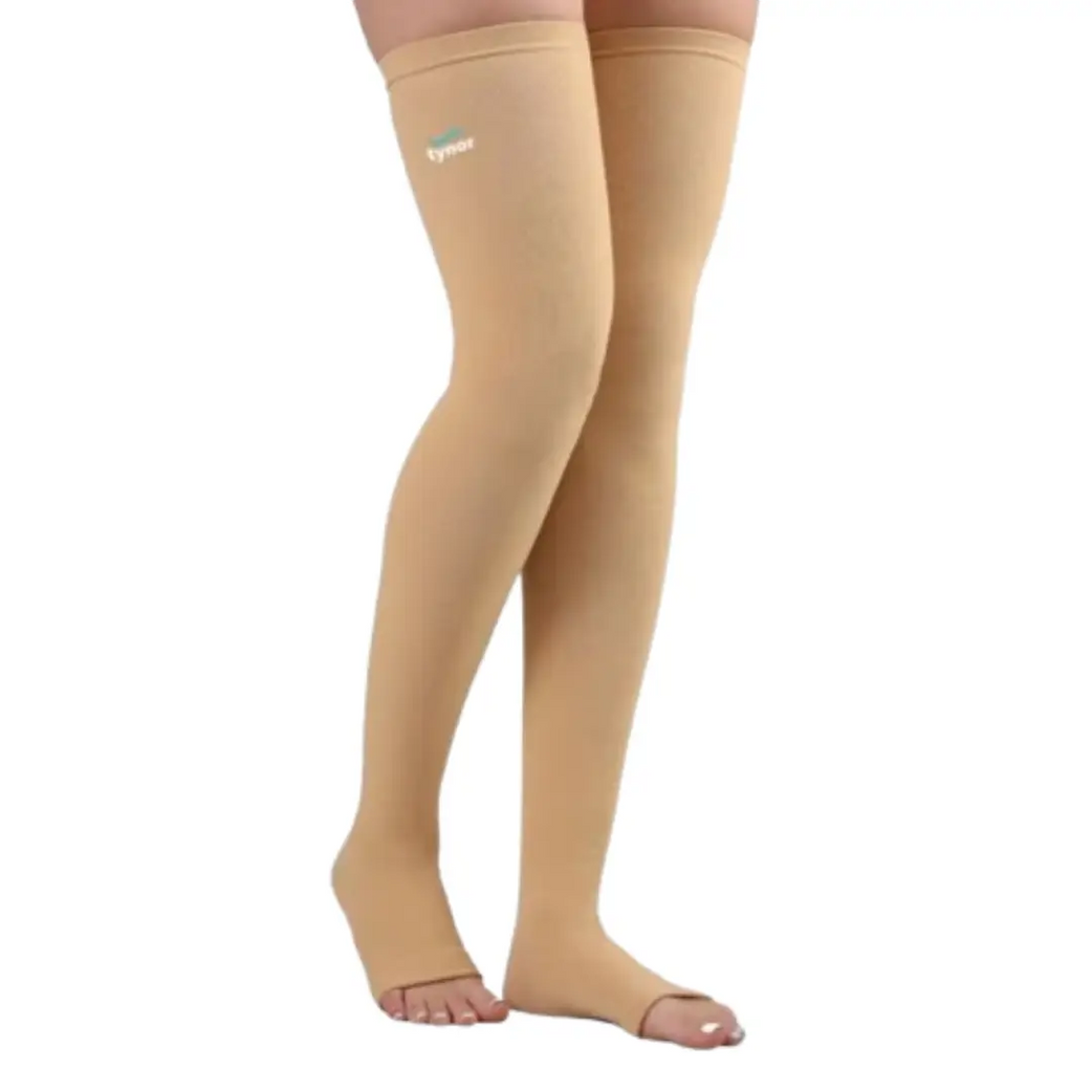 Person wearing mid thigh compression stockings for circulation support