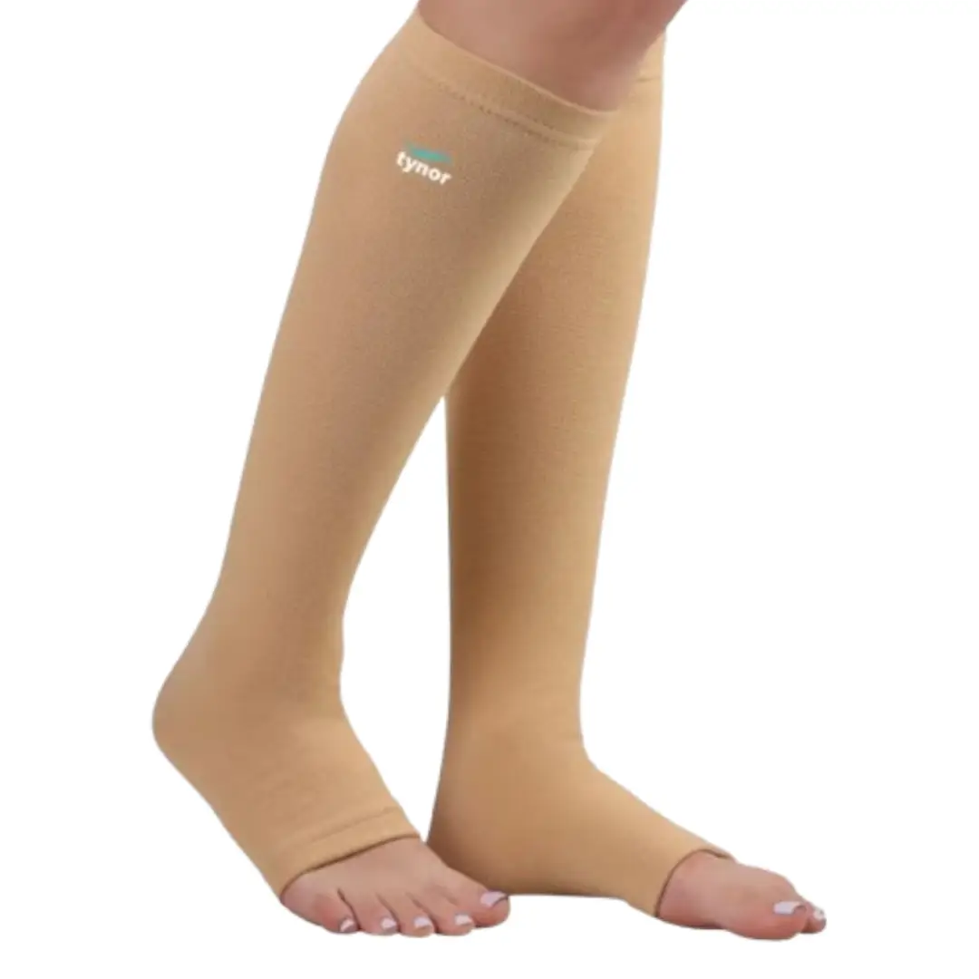 Person wearing below knee compression stockings for leg support