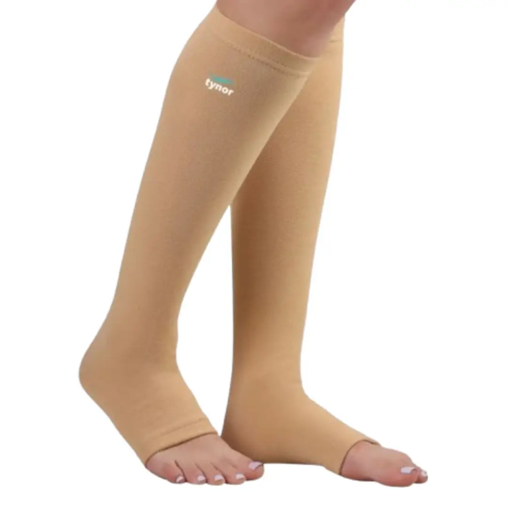 Person wearing below knee compression stockings for leg support
